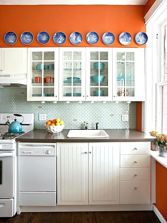 burnt orange kitchen cabinets love the blue plates against the orange wall burnt orange kitchen with white cabinets